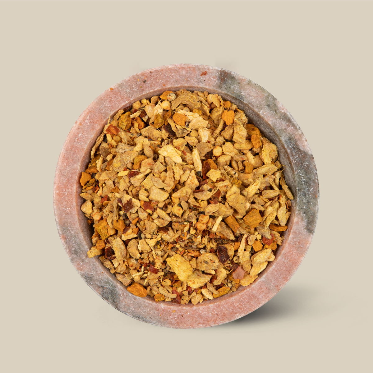 Firestorm caffeine-free herbal tea with ginger and chilli in a stone bowl
