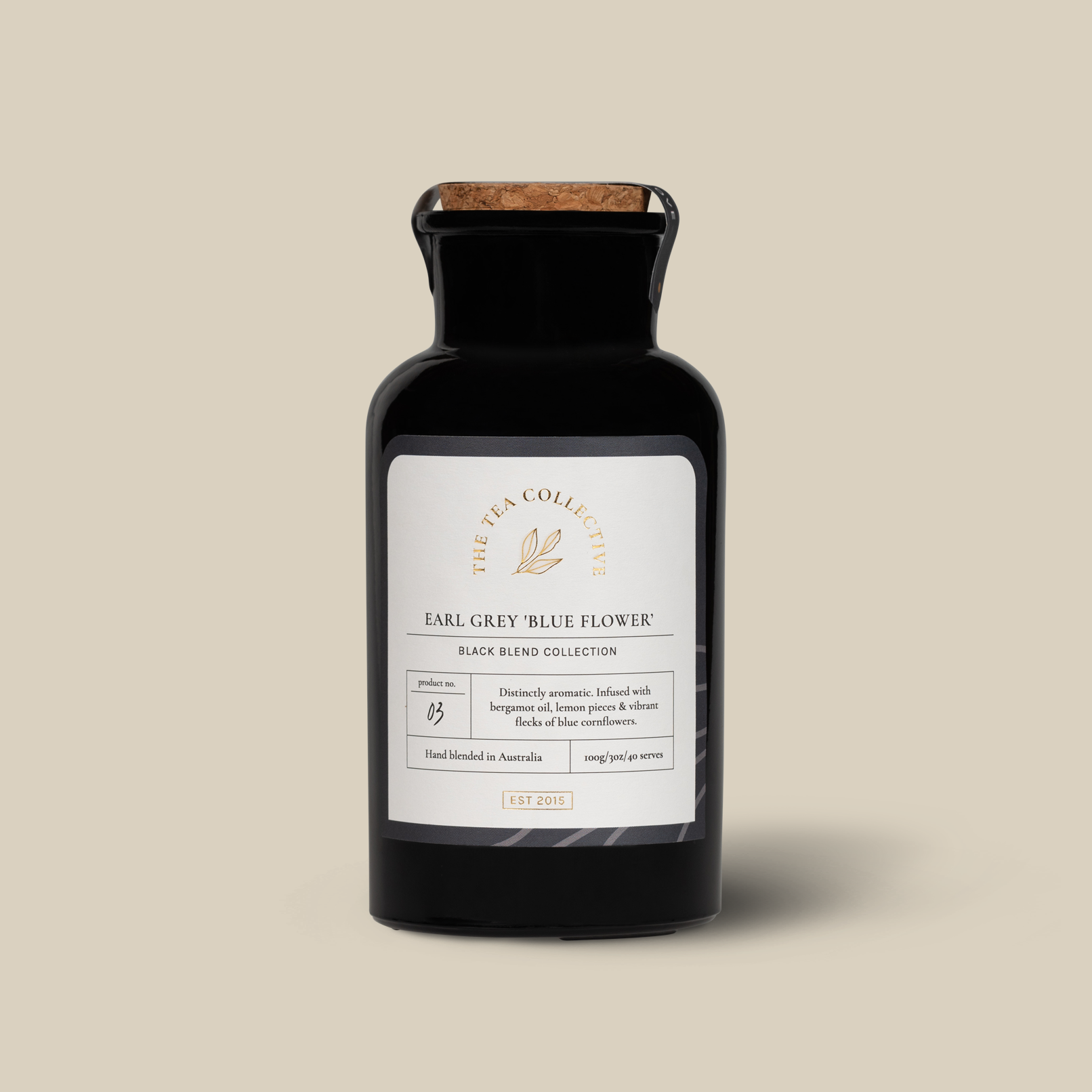A black bottle of Earl Grey tea with a label that reads 'Earl Grey Blue Flower'.