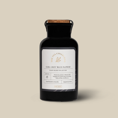 A black bottle of Earl Grey tea with a label that reads 'Earl Grey Blue Flower'. 